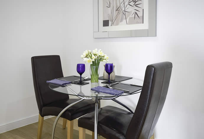 one bed serviced apartment dining area